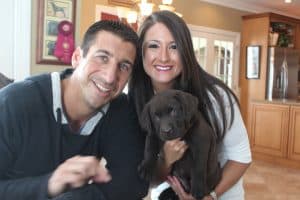 chocolate puppy with his new owners- Endless Mt. Labradors