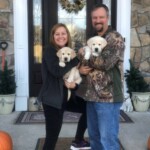 couple-with-puppies-endless-mt-labradors-yellow-labrador-pups-pickup-day-breeder-akc-english-labs